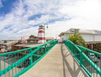 the pedestrian bridge and replica lighthouse at John's Pass Boardwalk